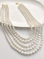 Load image into Gallery viewer, Multiple strands of pearls 
