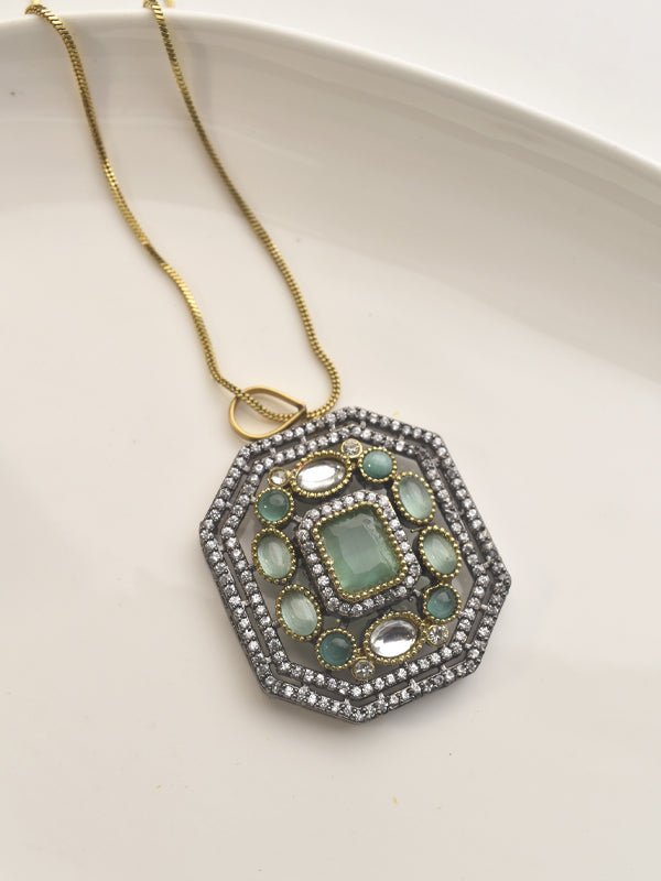 Necklace with an Ornate Pendant Featuring Green Stones 