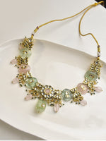 Load image into Gallery viewer, Necklace with golden accents and green and pink beads 
