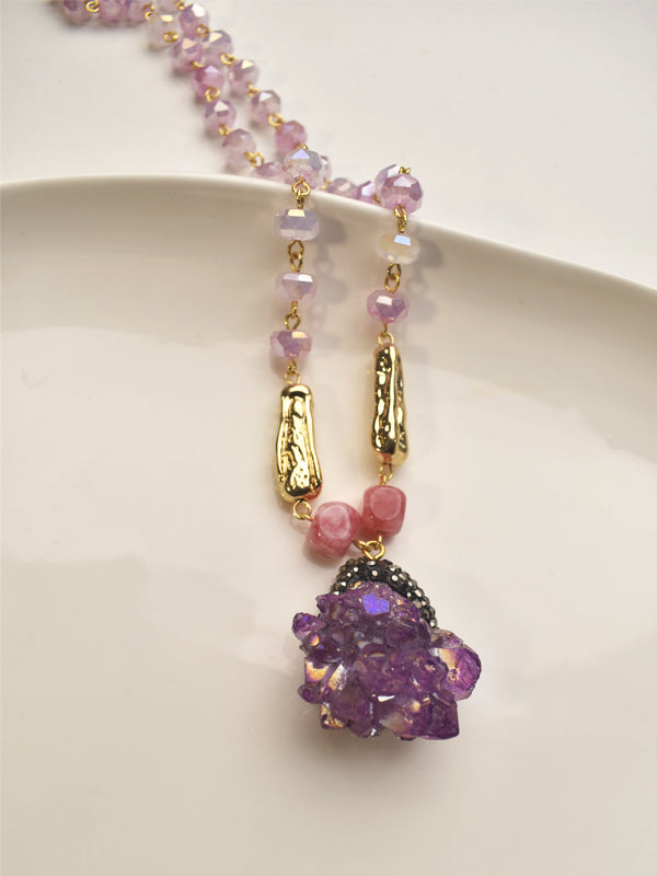 Necklace with pink and purple beads and a purple druzy pendant 