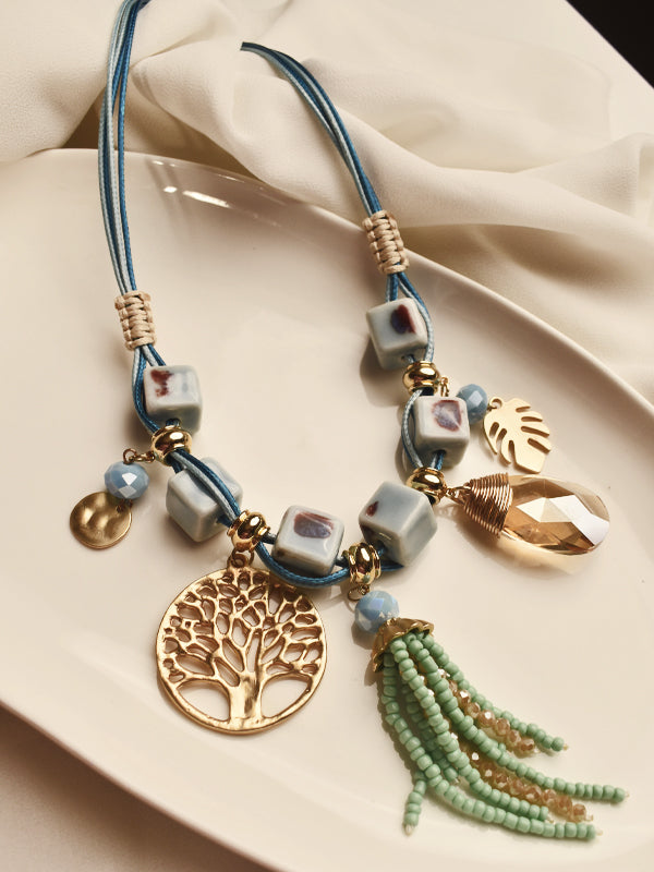 Necklace with tree of life charm and tassel 