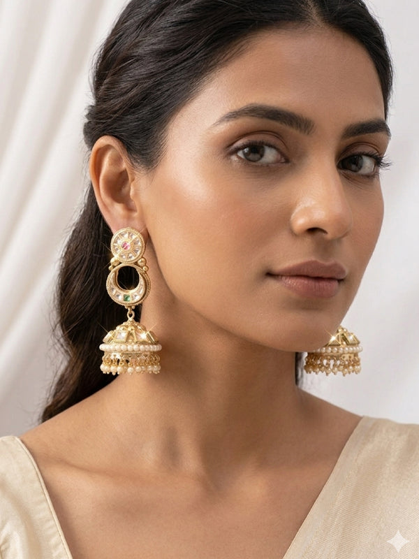 Ornate golden jhumkas with green stones | green earrings with pearl drops