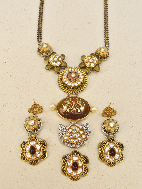 Ornate necklace with floral and circular designs 