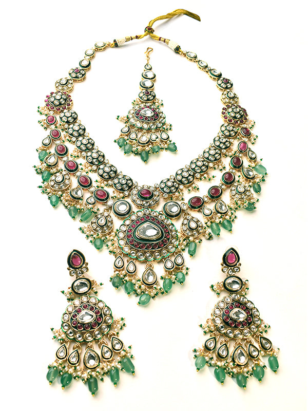 Ornate necklace set with green and red stones 
