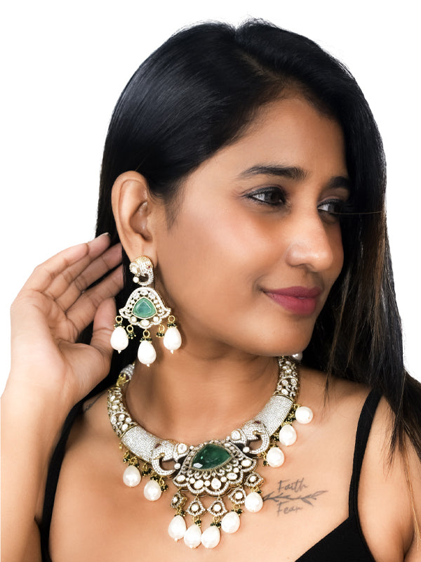 Ornate necklace with big green gemstone and pearls drops | stylish kundan necklace set