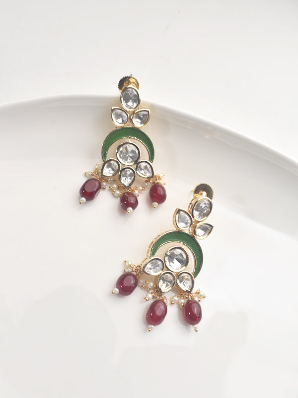 Ornate earrings with green and red stones 