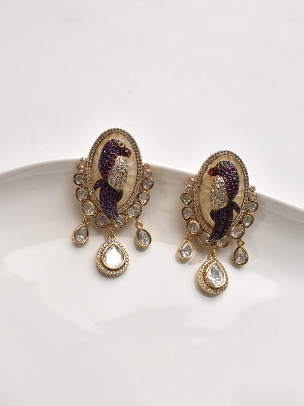 Ornate earrings with purple and golden design 