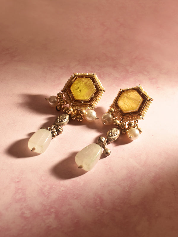 Ornate earrings with yellow gemstones and pearl like beads 