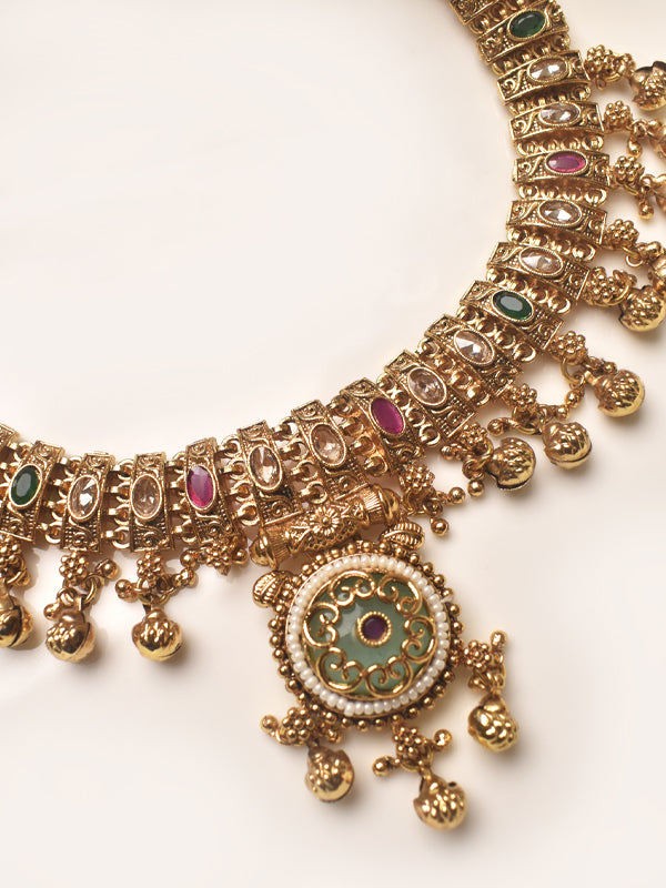 Ornate gold necklace with gemstones 