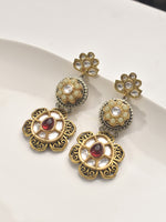 Load image into Gallery viewer, Ornate gold earrings with red stones 
