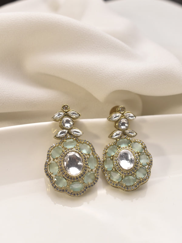 Pair of ornate earrings with gemstones 