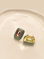 Load image into Gallery viewer, Pair of earrings with a pink gemstone 
