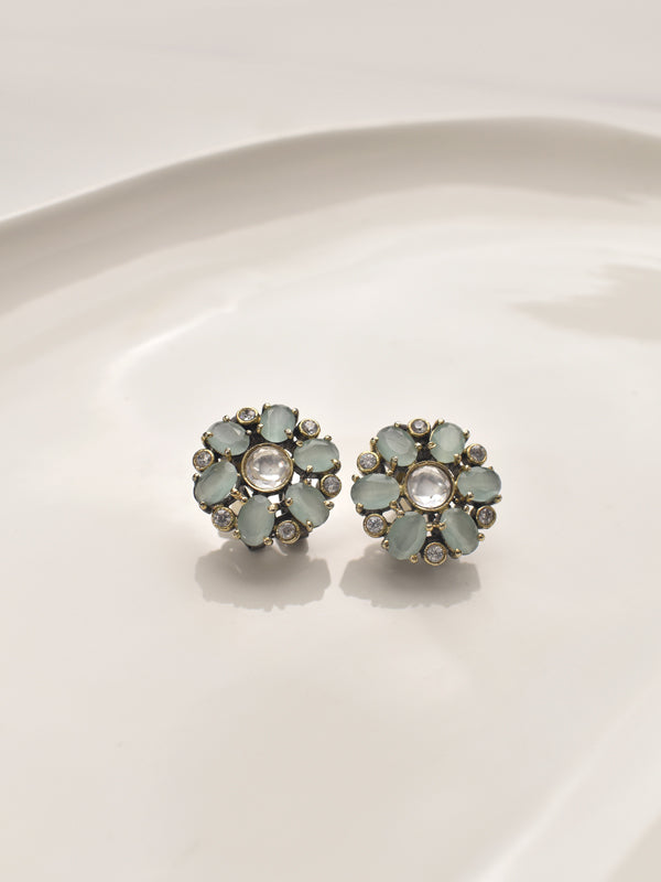 Pair of floral earrings with light blue gemstones 