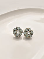 Load image into Gallery viewer, Pair of floral earrings with light blue gemstones 
