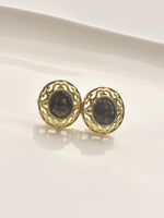 Load image into Gallery viewer, Pair of gold earrings with dark gemstones 
