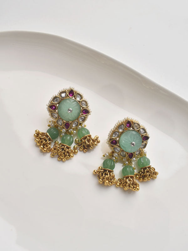 Pair of gold earrings with green and red gemstones 