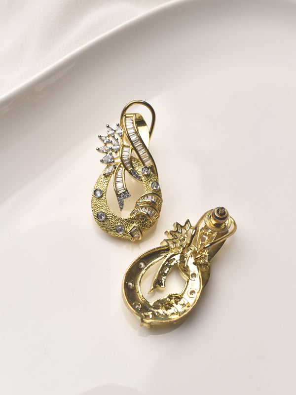 Pair of gold earrings with intricate designs