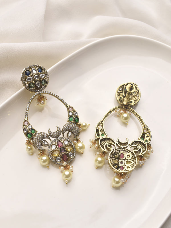 Pair of ornate earrings with gemstones and pearls 
