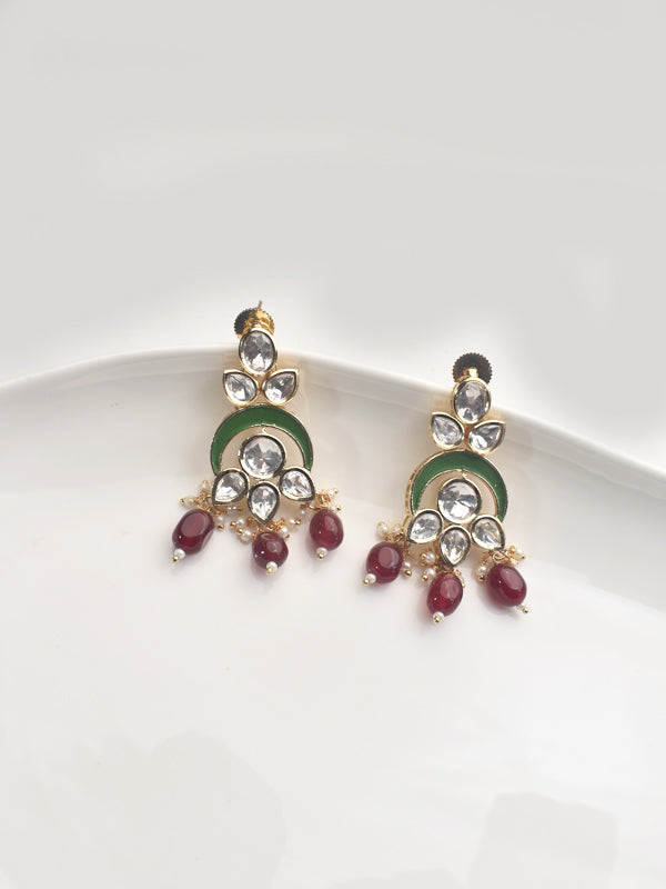 Pair of ornate earrings with gemstones 