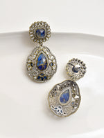 Load image into Gallery viewer, Pair of ornate earrings with blue gemstones 
