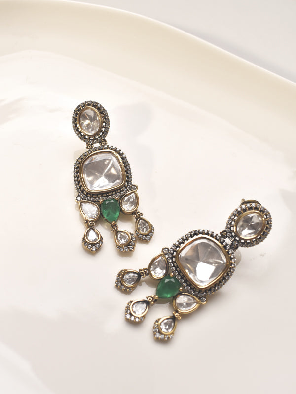 Pair of ornate earrings with gemstones 