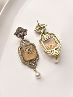 Load image into Gallery viewer, Pair of ornate earrings with intricate designs 
