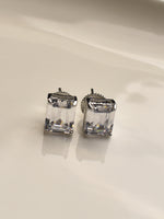 Load image into Gallery viewer, Pair of silver earrings with clear gemstones 

