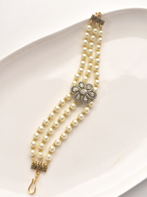 Pearl bracelet with decorative kundan  
