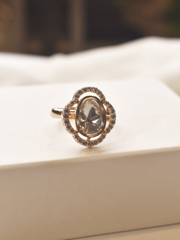 Rose gold finger ring with a central gemstone 