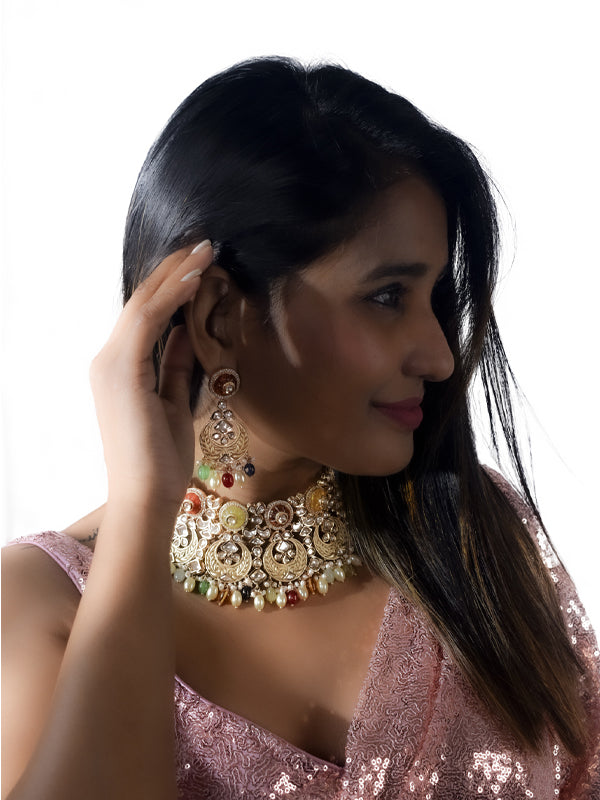 Woman wearing elaborate jewelry, including a necklace and earrings