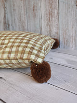 Brown and White Checks Cushion with Big Brown Pom Poms